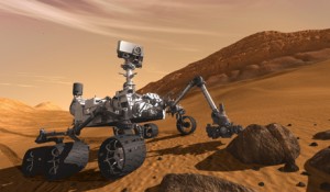 epa03011933 An undated handout artist concept image made available by NASA on 22 November 2011 showing NASA's Mars Science Laboratory Curiosity rover, a mobile robot for investigating Mars' past or present ability to sustain microbial life. Curiosity is being tested in preparation for launch, between 25 November 2011 and 18 December 2011. In this picture, the rover examines a rock on Mars with a set of tools at the end of the rover's arm, which extends about 2 meters (7 feet). Two instruments on the arm can study rocks up close. Also, a drill can collect sample material from inside of rocks and a scoop can pick up samples of soil. The arm can sieve the samples and deliver fine powder to instruments inside the rover for thorough analysis. The mast, or rover's 'head,' rises to about 2.1 meters (6.9 feet) above ground level, about as tall as a basketball player. This mast supports two remote-sensing instruments: the Mast Camera, or 'eyes,' for stereo color viewing of surrounding terrain and material collected by the arm; and, the ChemCam instrument, which is a laser that vaporizes material from rocks up to about 9 meters (30 feet) away and determines what elements the rocks are made of.  EPA/NASA/JPL-Caltech / HANDOUT  HANDOUT EDITORIAL USE ONLY