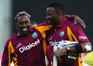 West Indies cricketers Dwayne Bravo (L) and Kieron Pollard celebrate their victory during the second-of-five One Day International (ODI) matches between West Indies and Australia at the Arnos Vale Ground in Kingstown on March 18, 2012. West Indies defeated Australia by 5 wickets to level the series 1-1. AFP PHOTO/Jewel Samad (Photo credit should read JEWEL SAMAD/AFP/Getty Images)