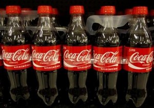 Bottles of Coca-Cola sit on a supermarket shelf in Gilbert, Arizona October 20, 2009. REUTERS/Joshua Lott