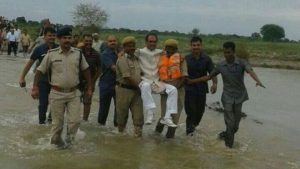 160822133453_india_flood_minister_carried__640x360_bbc_nocredit